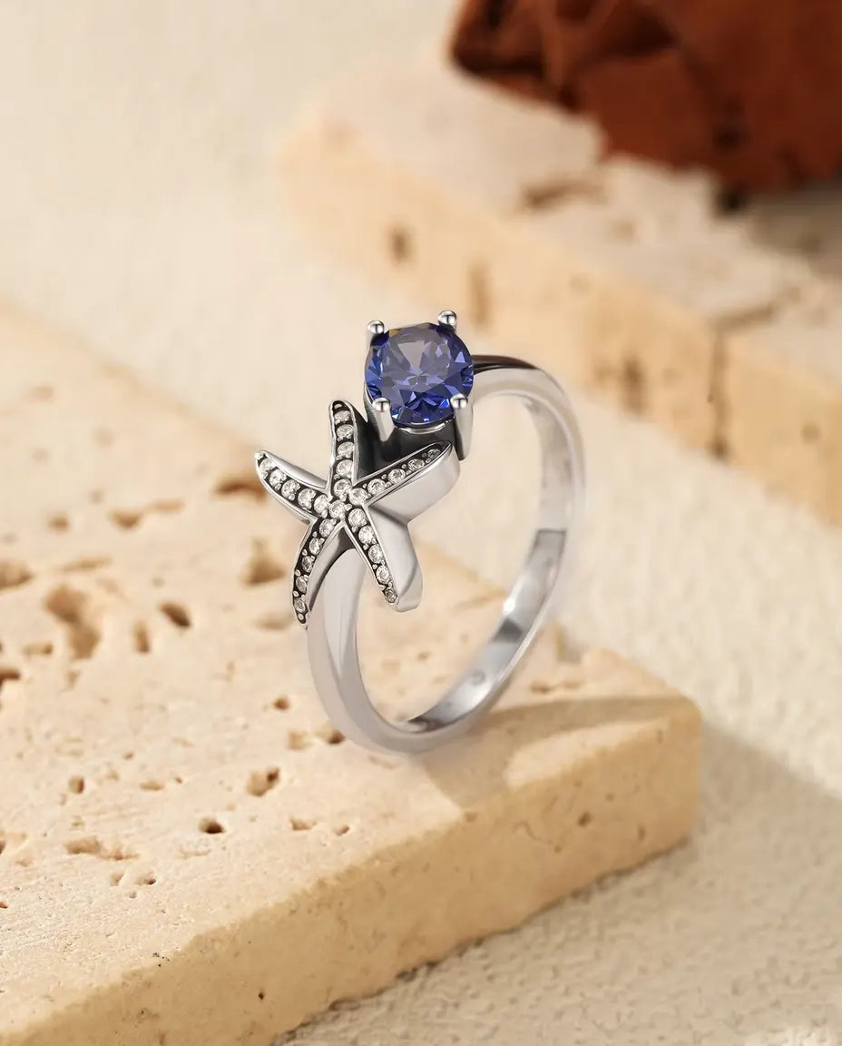 Anello Stella Marina - zircone viola ovale 5 x 7 mm e stella pavé, misure 5-9, argento 925