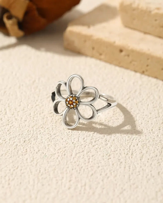 Anello fiore aperto - petali a giorno attorno a un cuore pavé arancio in argento 925 massiccio, misure US 5-9