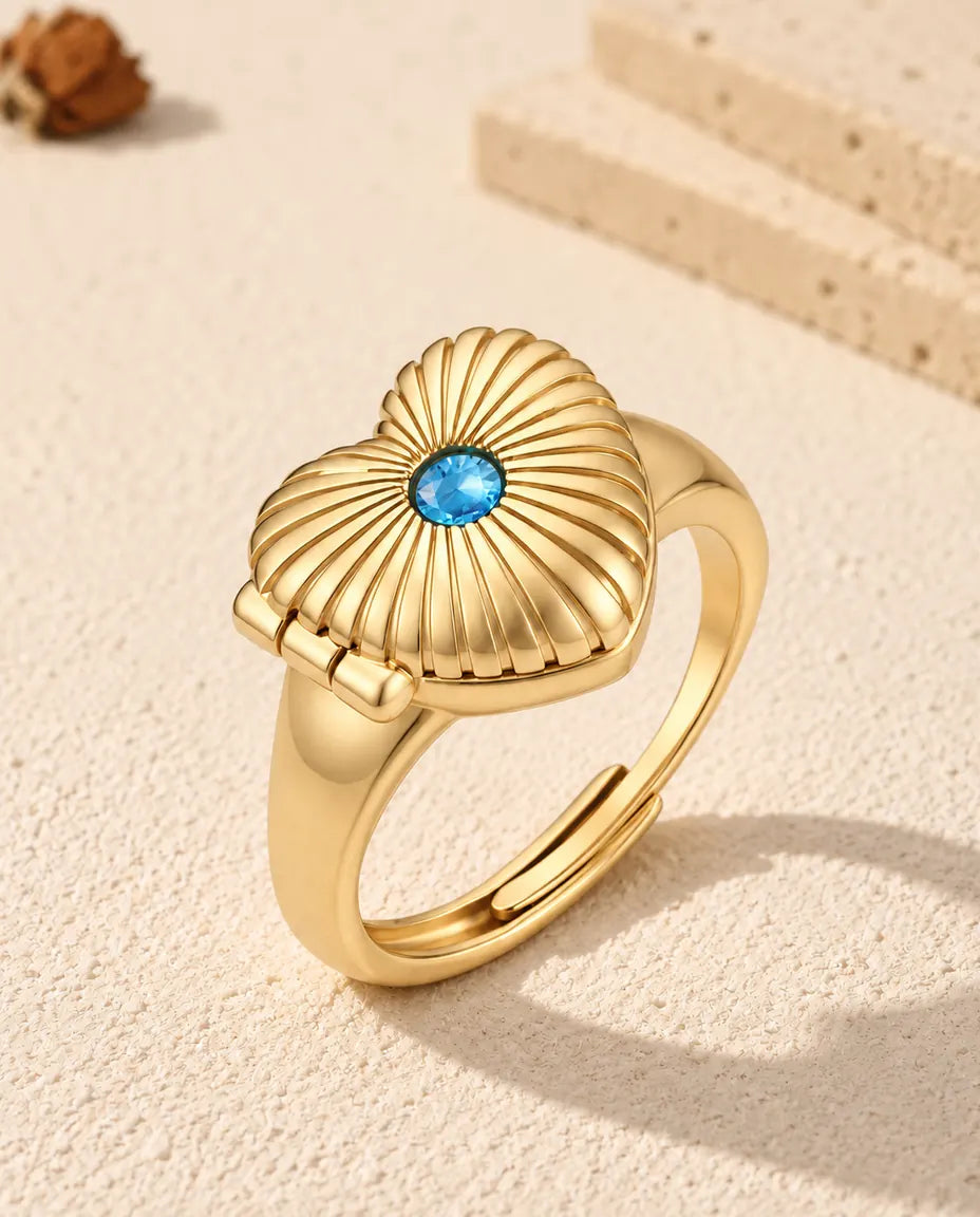 Anello portafoto a cuore personalizzato color oro con pietra di nascita blu sul coperchio a raggi