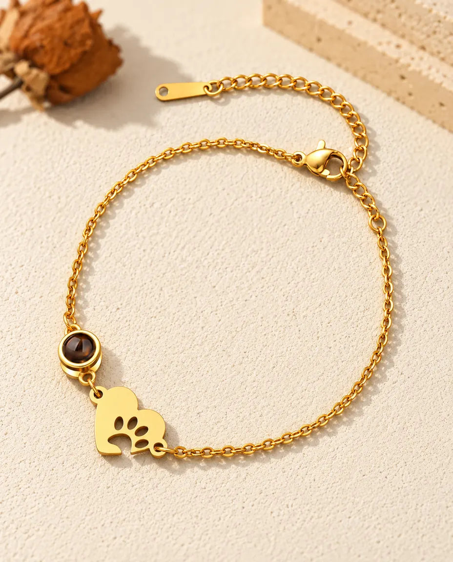 Bracciale ricordo per animali dorato con piastrina a cuore, impronta di zampa e catenella di estensione