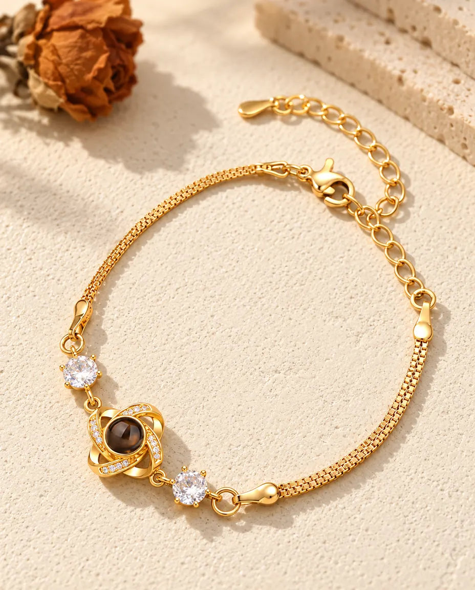 Bracciale dorato con nodo d'amore e foto dentro, chiusura a moschettone e catenella di prolunga