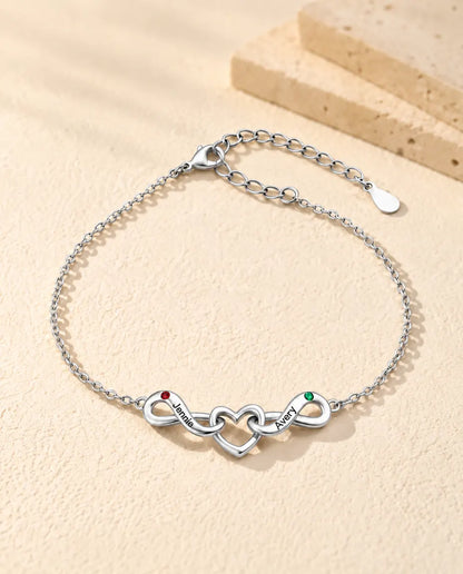 Bracciale Infinito Personalizzato 2 Nomi - due nodi infiniti attorno a un cuore e due pietre portafortuna - vista frontale