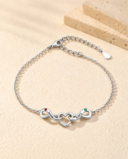 Bracciale Infinito Personalizzato 2 Nomi - due nodi infiniti attorno a un cuore e due pietre portafortuna - vista frontale