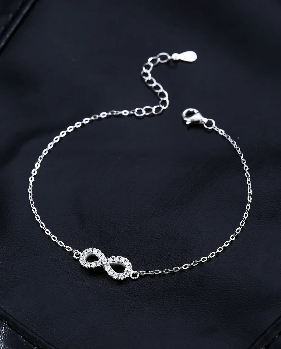 Bracciale Infinito con Moissanite – ventuno pietre pavé colore D su argento 925, catena regolabile
