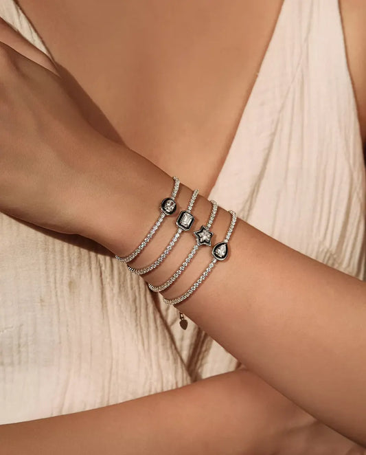 Bracciale Tennis in Argento 925 con Zirconia Centrale in Cornice Nera - quattro forme sovrapposte al polso