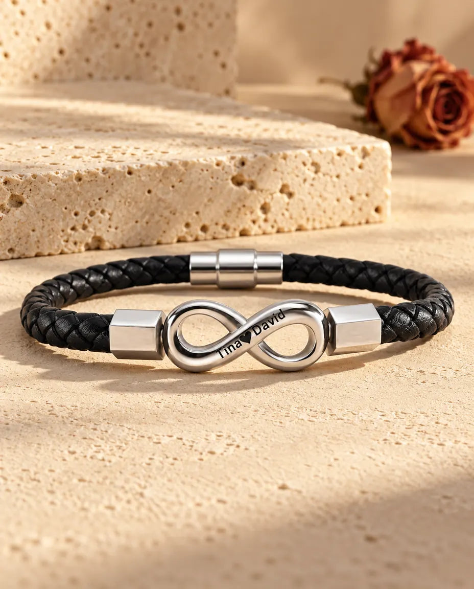 Infinito argentato in acciaio inossidabile con terminali esagonali su un bracciale in similpelle intrecciata nera