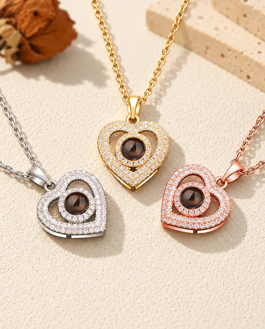 Collane con doppio cuore a pavé di zirconi in versione argentata, dorata e color oro rosa