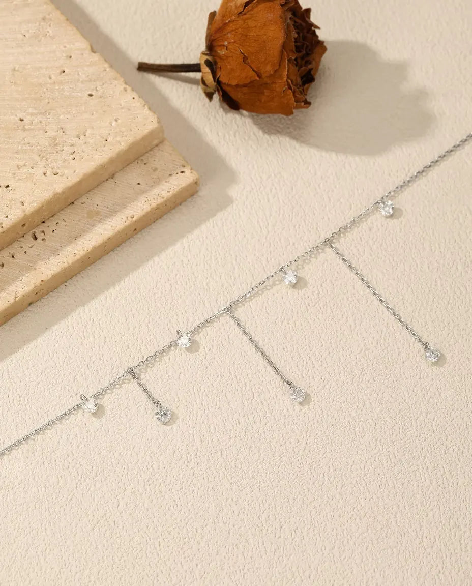Collana moissanite con sette pendenti - pietre da 0,30 ct e 4 mm su catena scalata, argento 925, 40+5 cm